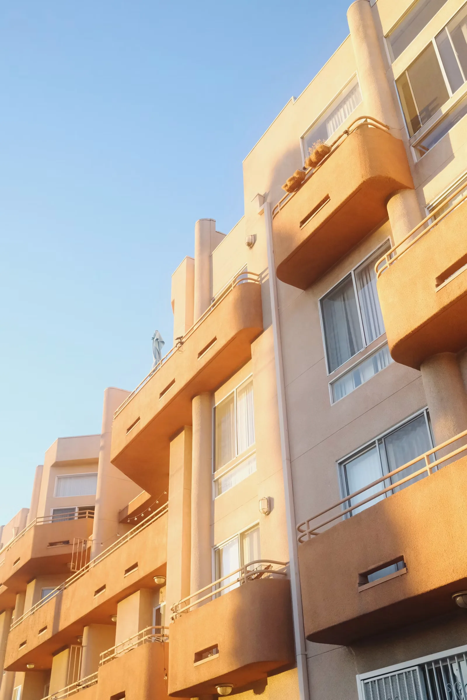 Multi-story apartment building with stacked balconies
