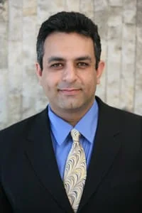 Fred Yadegar, attorney, in a dark suit and blue shirt